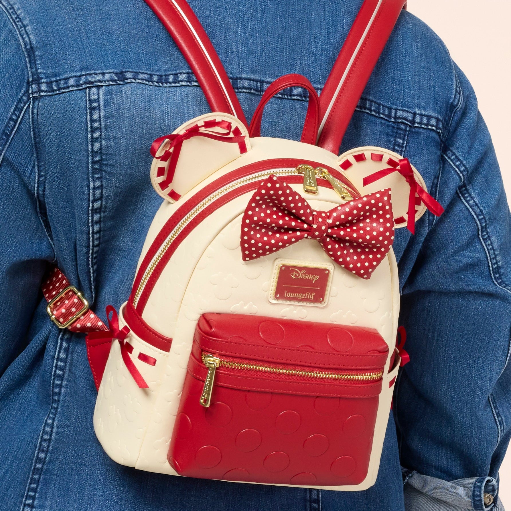 disney loungefly minnie mouse red mini backpack Exclusive Double Strap Shoulder Bag With Three Interchangeable Scented Bows This mini backpack is cream and red Loungefly Disney Minnie Mouse Red